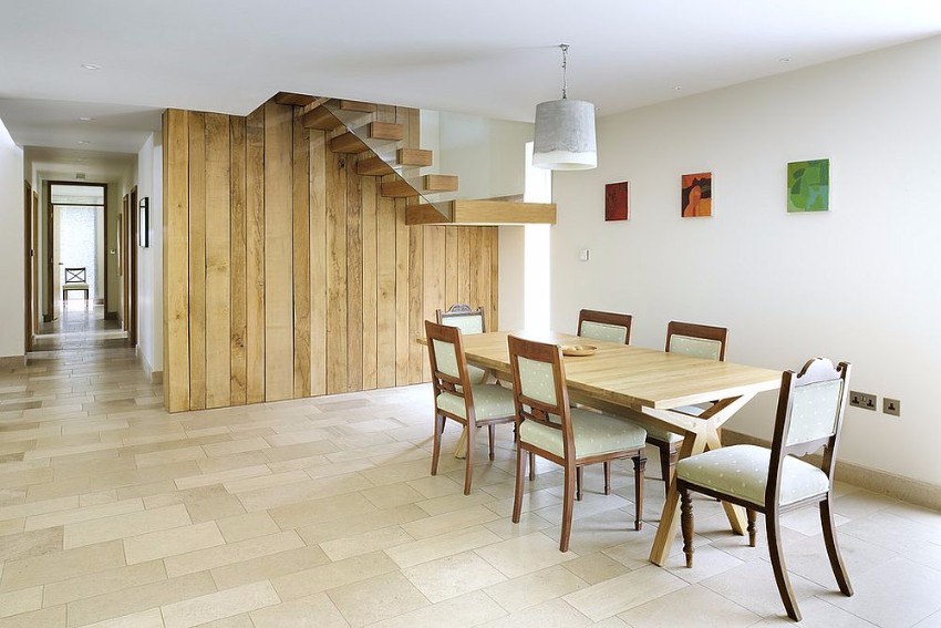 exquisite-reclaimed-wood-wall-with-staircase-becomes-the-backdrop-in-this-dining-room