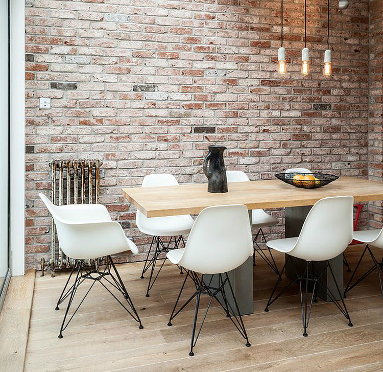 dining-space-in-the-corner-of-industrial-living-area-with-conservatory-roof